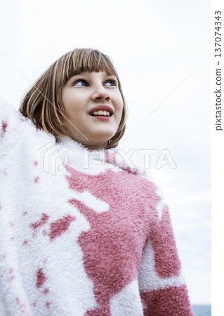 little cute blond girl curious smiling playing outside on sea, lifestyle people concept little cute blond girl curious smiling playing outside on sea, lifestyle people concept 137074343