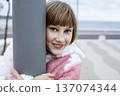 little cute blond girl curious smiling playing outside on sea, lifestyle people concept 137074344