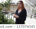 young red head woman walking on Europe city, lifestyle people concept 137074345