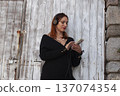 young red head woman walking on Europe city, lifestyle people concept 137074354