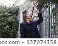young red head woman walking on Europe city, lifestyle people concept 137074358