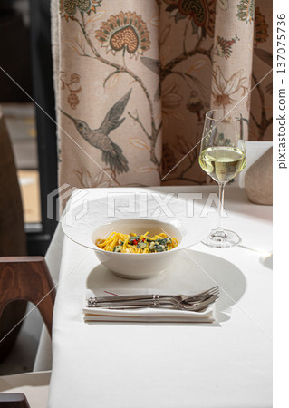 Creamy spinach pasta in white bowl Creamy spinach pasta in white bowl 137075736