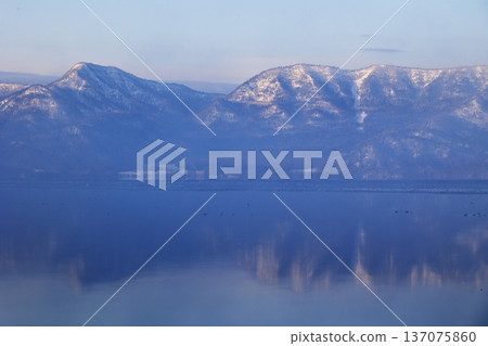 Mount Mokoto shrouded in morning mist 137075860