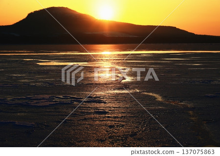 Frozen lake at sunrise Frozen lake at sunrise 137075863