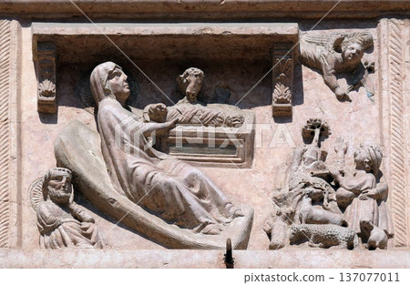 Birth of Jesus, relief on Facade of Sant`Anastasia Church in Verona, Italy 137077011