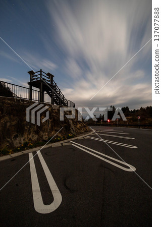 Parking lot with flowing clouds and observation deck Parking lot with flowing clouds and observation deck 137077888