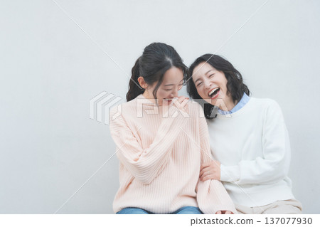 Retro-inspired portrait of a close mother and daughter Retro-inspired portrait of a close mother and daughter 137077930