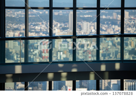 Image of a cityscape seen from the observation deck of a high-rise building 137078828