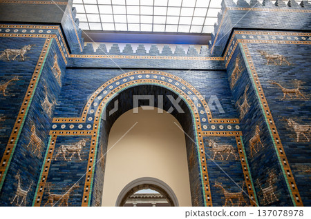 Berlin, germany, august 16, 2023. Ancient ishtar gate, a reconstruction from babylon, exhibiting intricate blue glazed bricks with bas-relief animals at pergamon museum Berlin, germany, august 16, 2023. Ancient ishtar gate, a reconstruction from babylon, exhibiting intricate blue glazed bricks with bas-relief animals at pergamon museum 137078978