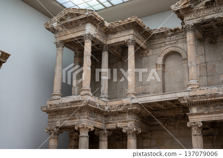 Berlin, germany, august 16,2023. Market gate of miletus reconstructed in pergamon museum, berlin monumental roman marble facade with columns, carvings, and arches 137079006