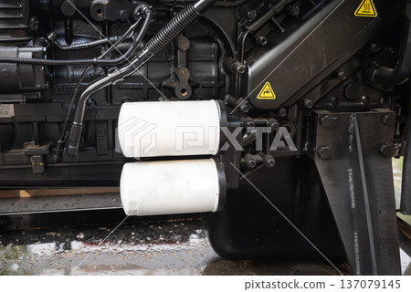 Close-up of a complex automotive engine system with white filters. Close-up of a complex automotive engine system with white filters. 137079145