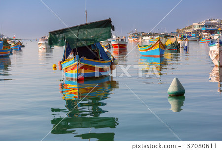 Traditional luzzu fishing boats in Marsaxlokk harbor Malta Traditional luzzu fishing boats in Marsaxlokk harbor Malta 137080611
