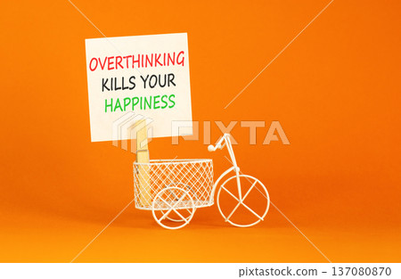 Overthinking kills your happiness symbol. Concept words Overthinking kills your happiness on white paper. Beautiful orange background. Business overthinking kills happiness concept. Copy space. Overthinking kills your happiness symbol. Concept words Overthinking kills your happiness on white paper. Beautiful orange background. Business overthinking kills happiness concept. Copy space. 137080870