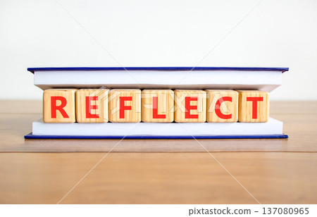 Reflect word symbol. Concept word Reflect on beautiful wooden blocks in book. Beautiful wooden table white background. Business psychological reflect word concept. Copy space. Reflect word symbol. Concept word Reflect on beautiful wooden blocks in book. Beautiful wooden table white background. Business psychological reflect word concept. Copy space. 137080965