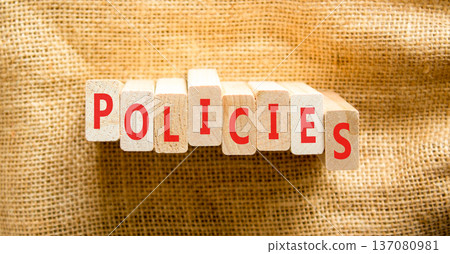 Policies word symbol. Concept word Policies on beautiful wooden blocks. Beautiful canvas background. Business support help policies word concept. Copy space. 137080981