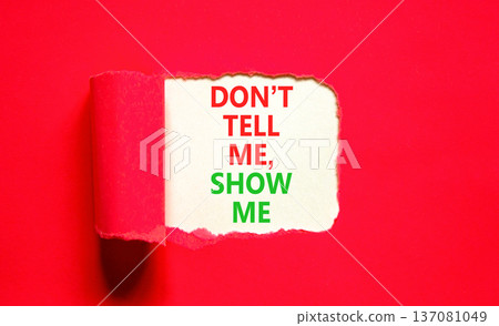 Tell or show symbol. Concept words Do not tell me, show me on beautiful white paper. Beautiful red paper background. Business tell or show concept. Copy space. Tell or show symbol. Concept words Do not tell me, show me on beautiful white paper. Beautiful red paper background. Business tell or show concept. Copy space. 137081049
