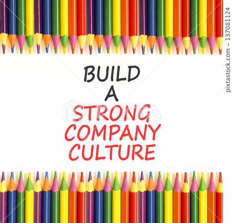 Strong company culture symbol. Concept words Build a strong company culture on beautiful white paper. Beautiful white background. Colored pencils. Business strong company culture concept. Copy space. Strong company culture symbol. Concept words Build a strong company culture on beautiful white paper. Beautiful white background. Colored pencils. Business strong company culture concept. Copy space. 137081124