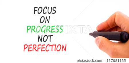 Progress or perfection words symbol. Concept words Focus on progress not perfection on beautiful white paper. Beautiful white background. Business progress or perfection concept. Copy space. Progress or perfection words symbol. Concept words Focus on progress not perfection on beautiful white paper. Beautiful white background. Business progress or perfection concept. Copy space. 137081135