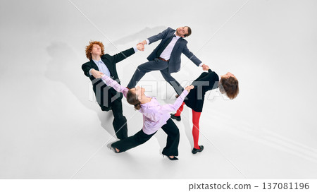 Business team in dynamic circle formation on white studio background Business team in dynamic circle formation on white studio background 137081196