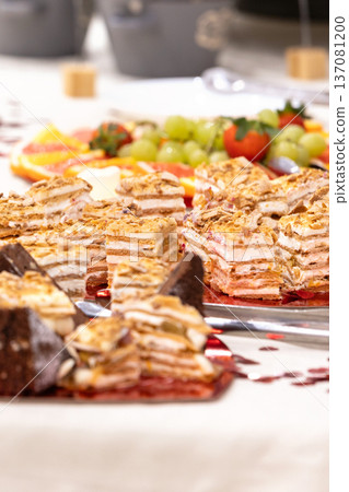 Assorted layered cakes and pastries table Assorted layered cakes and pastries table 137081200
