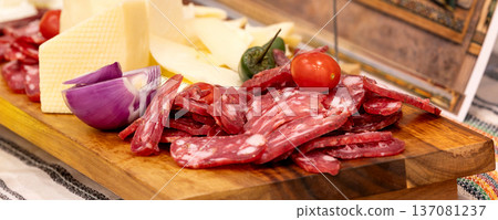 Sliced salami and cheese platter banner Sliced salami and cheese platter banner 137081237