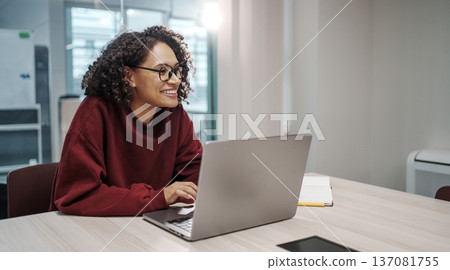 Woman Engaged In Collaborative UX Design Process Using Wireframes And Sticky Notes In Workspace Woman Engaged In Collaborative UX Design Process Using Wireframes And Sticky Notes In Workspace 137081755
