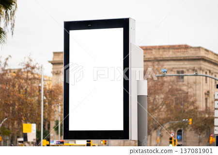 Blank outdoor advertising digital kiosk display screen mockup on a city street 137081901