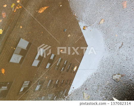 The Architecture backgrounds and objects. Reflection in a puddle. The Architecture backgrounds and objects. Reflection in a puddle. 137082314