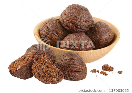chocolate cookie with kerob, banana, nuts and coconut paste isolated on white background. Healthy food, gluten-free, flour-free chocolate cookie with kerob, banana, nuts and coconut paste isolated on white background. Healthy food, gluten-free, flour-free 137083065
