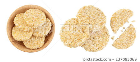 coconut cookies with white flax seeds and honey in wooden bowl isolated on white background. Healthy food. Top view. Flat lay coconut cookies with white flax seeds and honey in wooden bowl isolated on white background. Healthy food. Top view. Flat lay 137083069