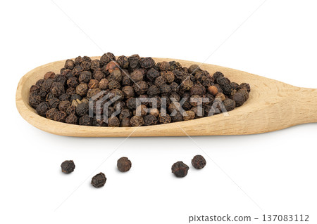 Black peppercorns or pepper in a wooden spoon isolated on a white background Black peppercorns or pepper in a wooden spoon isolated on a white background 137083112