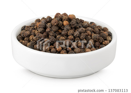 Black peppercorns or pepper in a ceramic bowl isolated on a white background 137083113