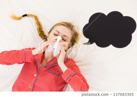 Woman being sick having flu lying on bed Woman being sick having flu lying on bed 137083305
