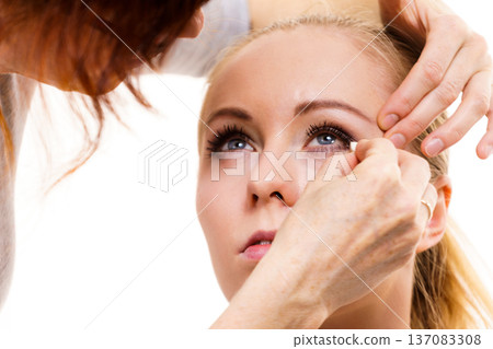 Makeup artist apply make up Makeup artist apply make up 137083308