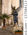 statue of a man in a city 137084113