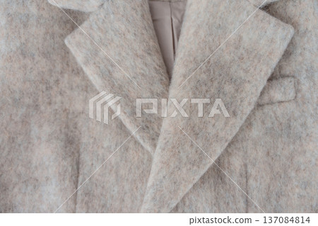 Soft fuzzy wool-blend coat lapel closeup showing tailoring detail and warm texture Soft fuzzy wool-blend coat lapel closeup showing tailoring detail and warm texture 137084814