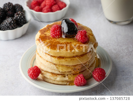 Fluffy Pancake Stack with Berries and Syrup Fluffy Pancake Stack with Berries and Syrup 137085728