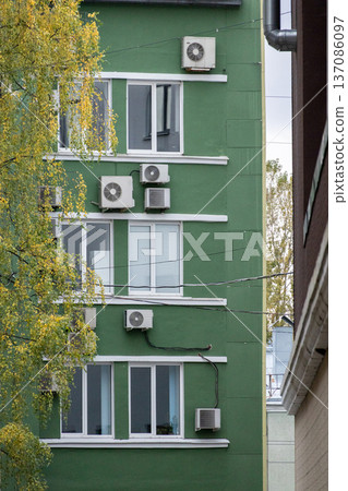 air conditioning on facade of building, air cooling in hot weather.  137086097