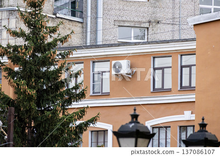 air conditioning on facade of building, air cooling in hot weather.  137086107