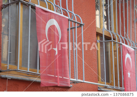 Turkish flags hanging on balcony in colorful neighborhood Turkish flags hanging on balcony in colorful neighborhood 137086875