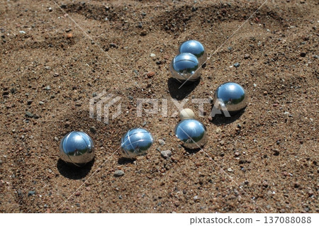 Shiny steel balls in the sand 137088088