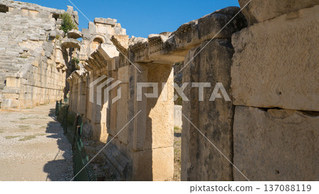 Ancient Stone Archway of Mediterranean Ruins Under a Clear Blue Sky in Demre, Turkey 137088119
