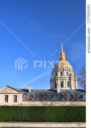 The moon in the blue sky and the Dome of the Invalides, Paris, photographed on February 25, 2026 137089261