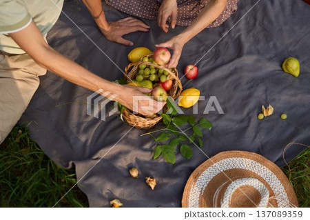 Vibrant picnic setup featuring fresh fruit and artistic food styling Vibrant picnic setup featuring fresh fruit and artistic food styling 137089359