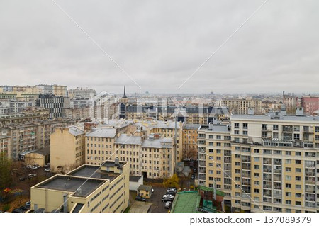 Dull gray cityscape featuring layered roofs and distant horizons Dull gray cityscape featuring layered roofs and distant horizons 137089379