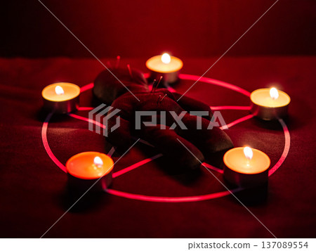 Voodoo doll on a pentagram. Witch spells. Voodoo doll on a pentagram. Witch spells. 137089554