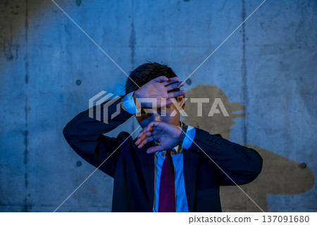 A man avoiding the flash A man avoiding the flash 137091680