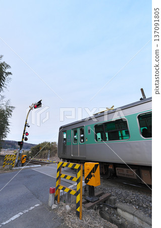 Railroad crossing next to Taki Station on the Karasuyama Line in Nasukarasuyama City 137091805