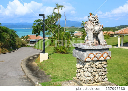 Shisa stone statue and the blue sea of Okinawa Shisa stone statue and the blue sea of Okinawa 137092380