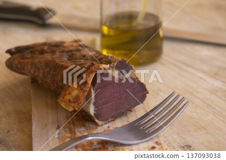 Homemade cured pork loin on wooden board 137093038